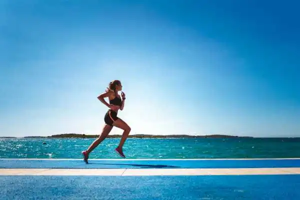 Woman running showing strong leg muscle Sutton in Ashfield